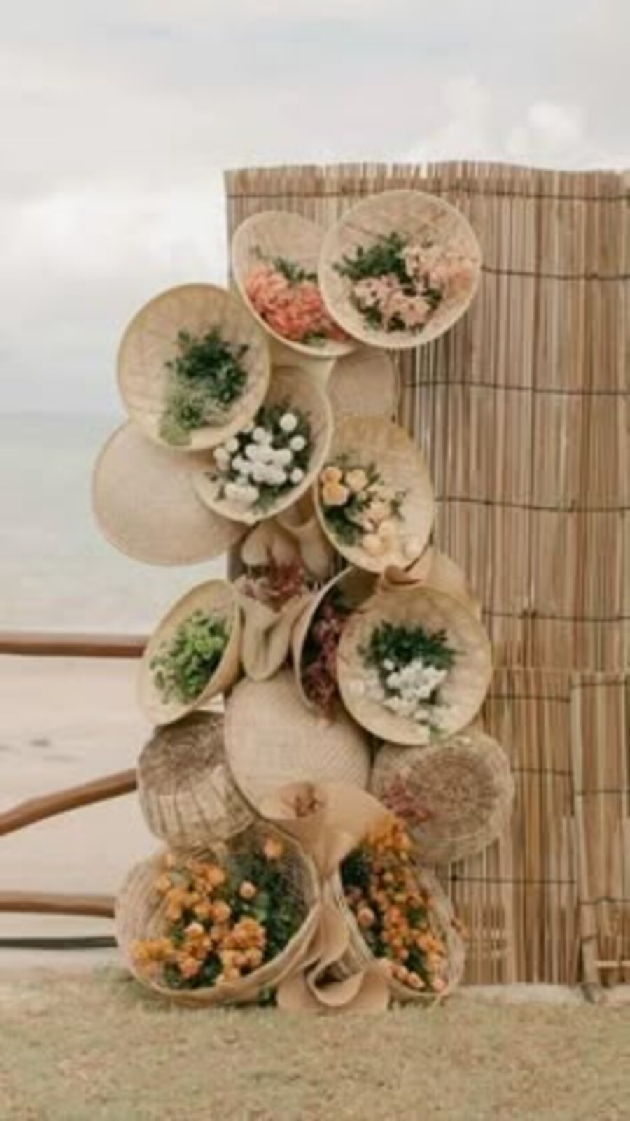 Woven fans and grasses dressed with flowers